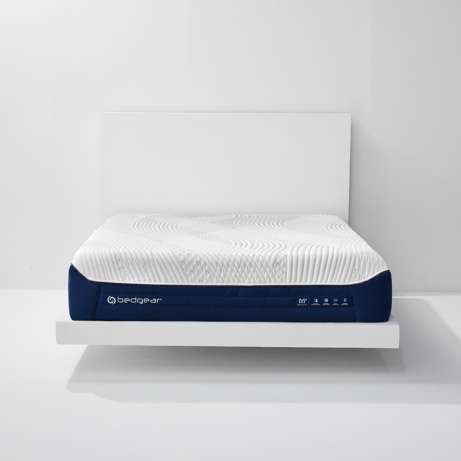 Bedgear M5 Performance mattress in White and Navy, front view on a bed