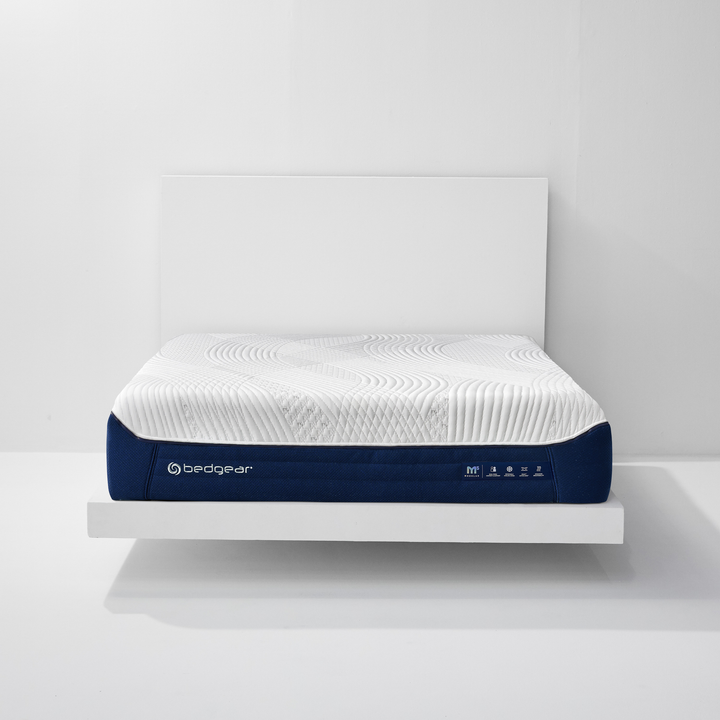Bedgear M5 Performance mattress in White and Navy, front view on a bed