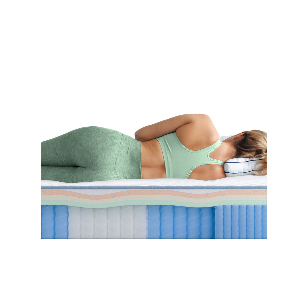 Side sleeper on Bear Elite Hybrid showing zoned spine alignment support