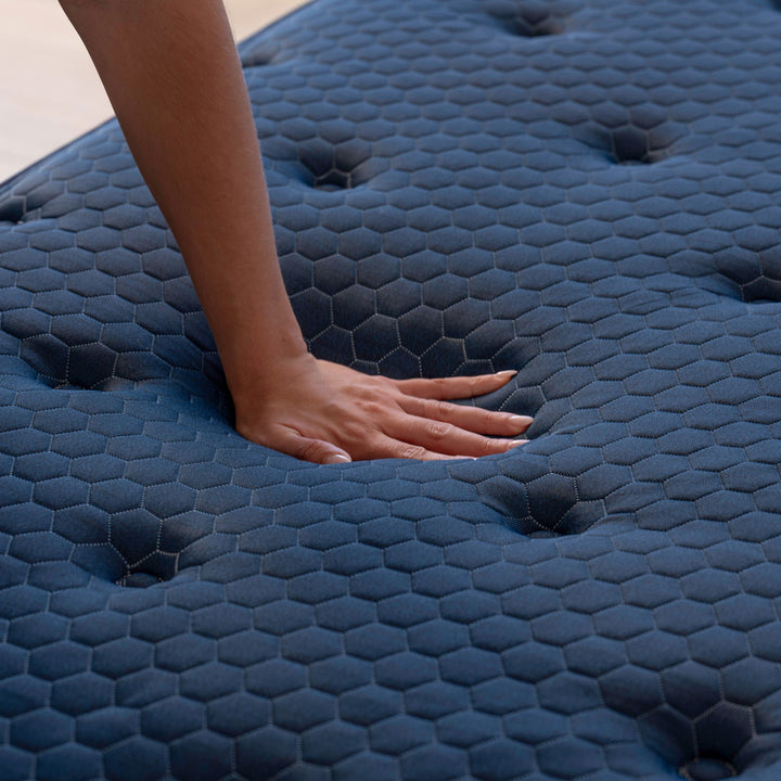Demonstration of pressure relief and surface contouring on the Brooklyn Bedding Signature Hybrid RV mattress — available in Soft, Medium, and Firm comfort levels with optional cooling pillow top from Magic Sleeper