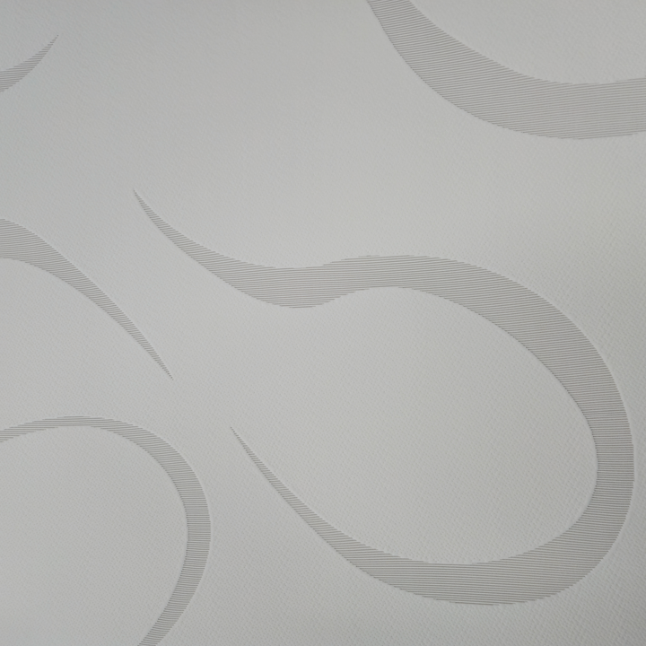 Detailed texture of the soft swirl-pattern stretch-knit cover on a gel memory foam RV mattress