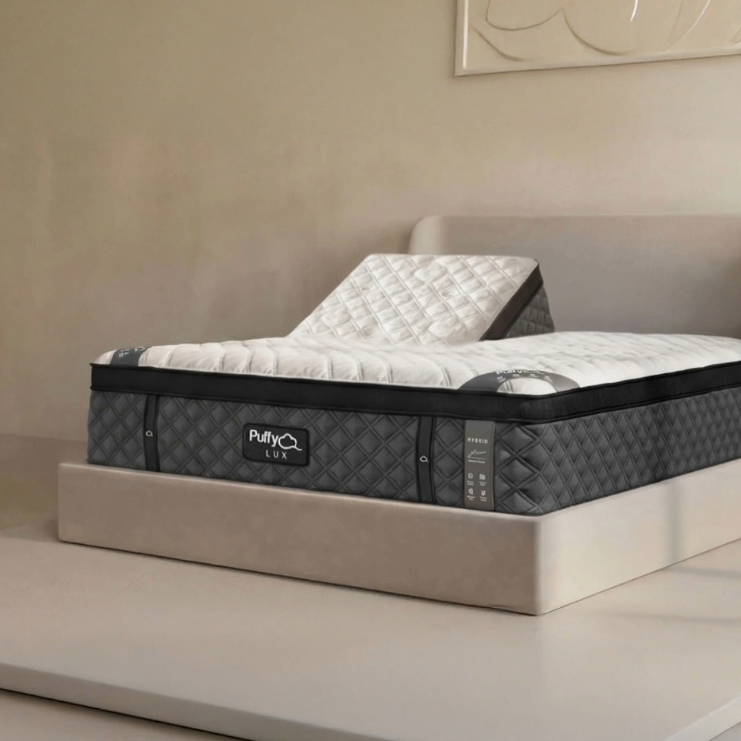 Puffy Lux Hybrid Split Top mattress showing independent head adjustment on power base
